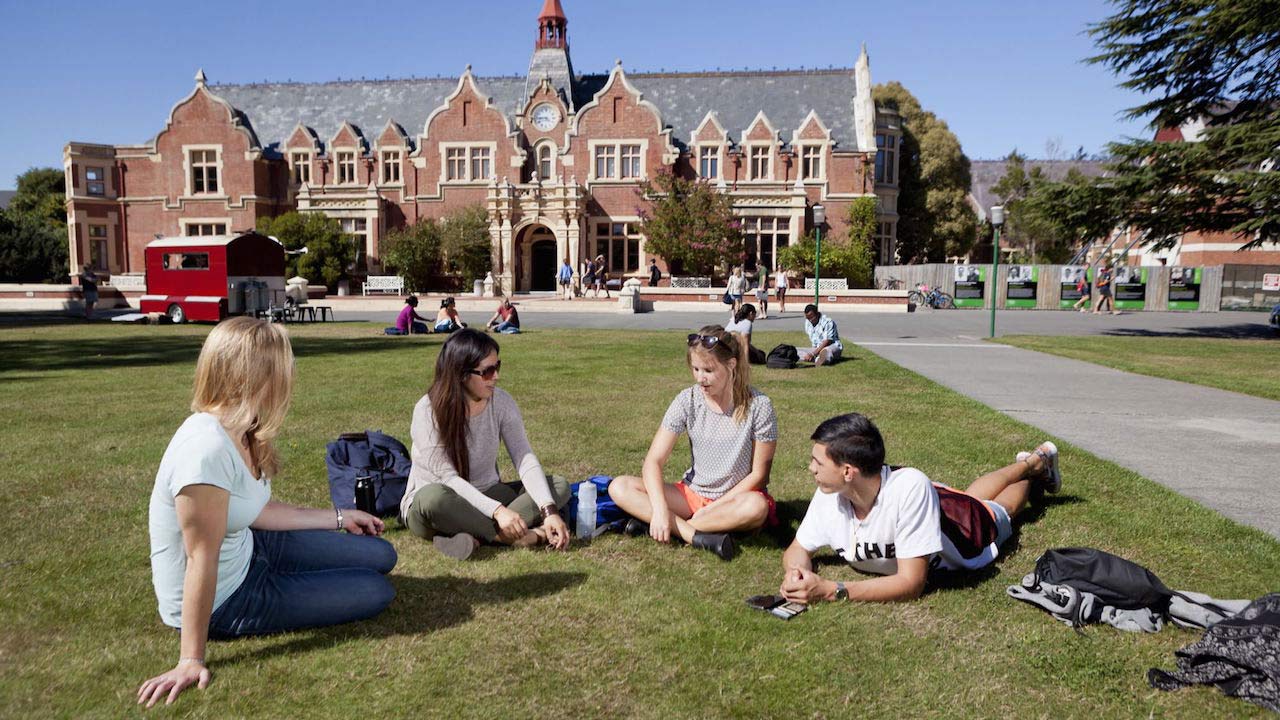 A group of students lay conversing on the quad on Lincoln University's campus