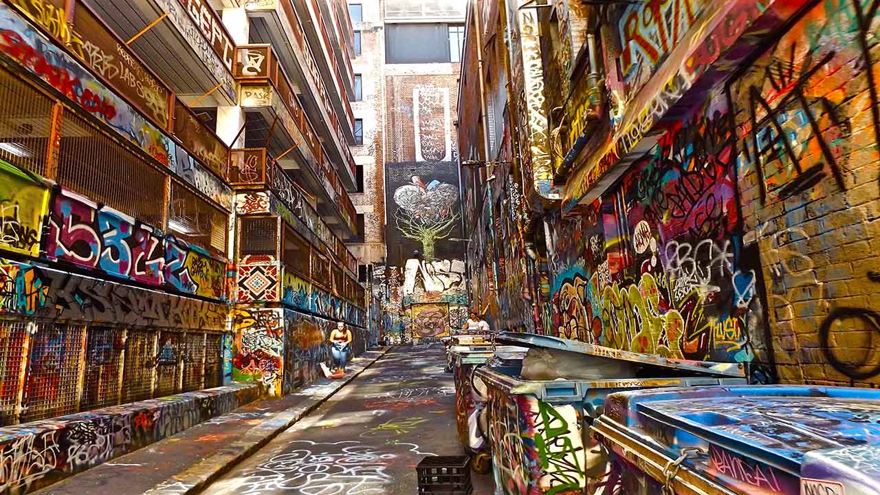A colorful alleyway in downtown Melbourne that has been covered in graffiti by local artists
