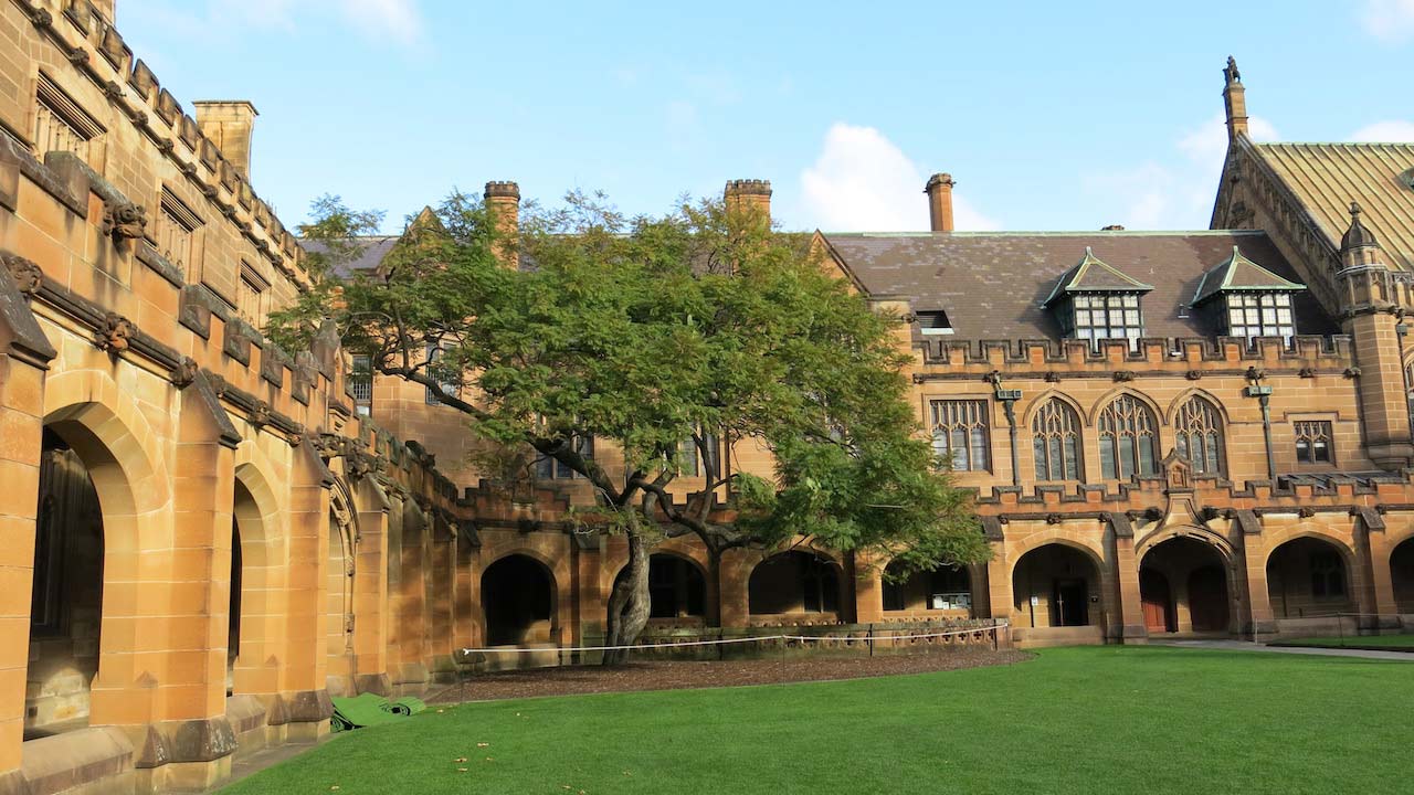 Hogwarts-like architecture on University of Sydney's campus on a sunny day
