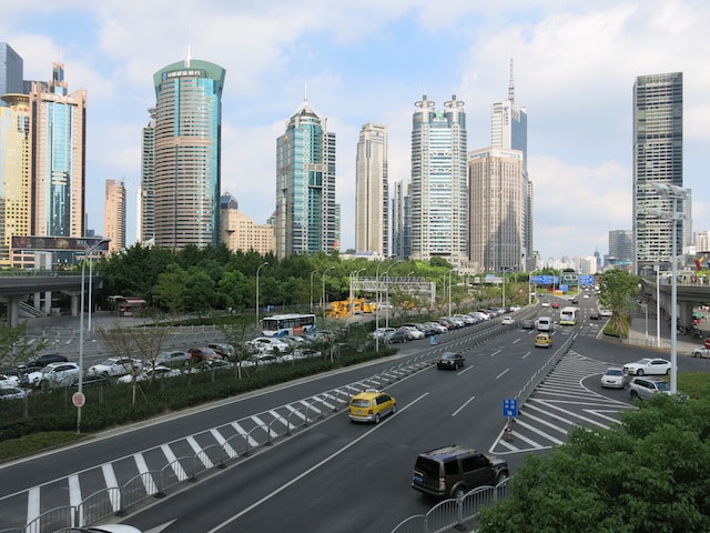 A highway in Shanghai with buildings in the background